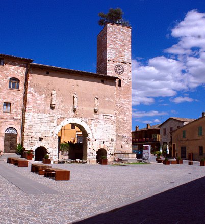 What to see in Spello-Porta Consolare-Umbria-pink stone-Olive tree