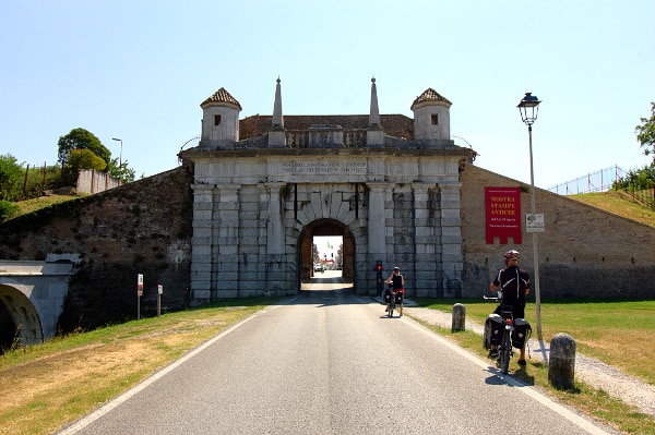 What to see in Palmanova- Porta Udine- Venetian Aqueduct- Walls- Bastions- cyclists- 